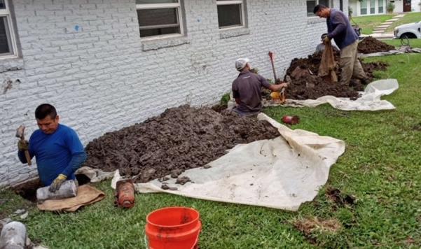 Foundation Repair Crew — Our experienced team excavating and preparing a residential foundation