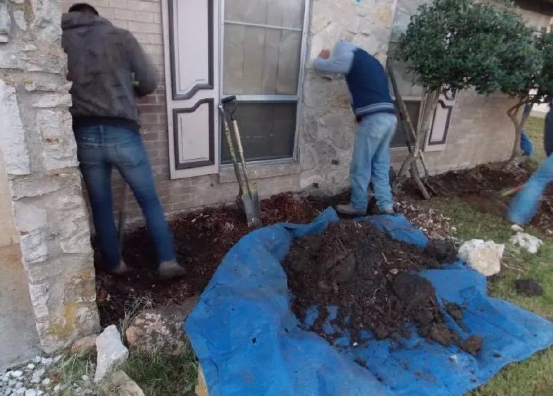 Perimeter Drainage Prep — Preparing soil and grading around building foundation